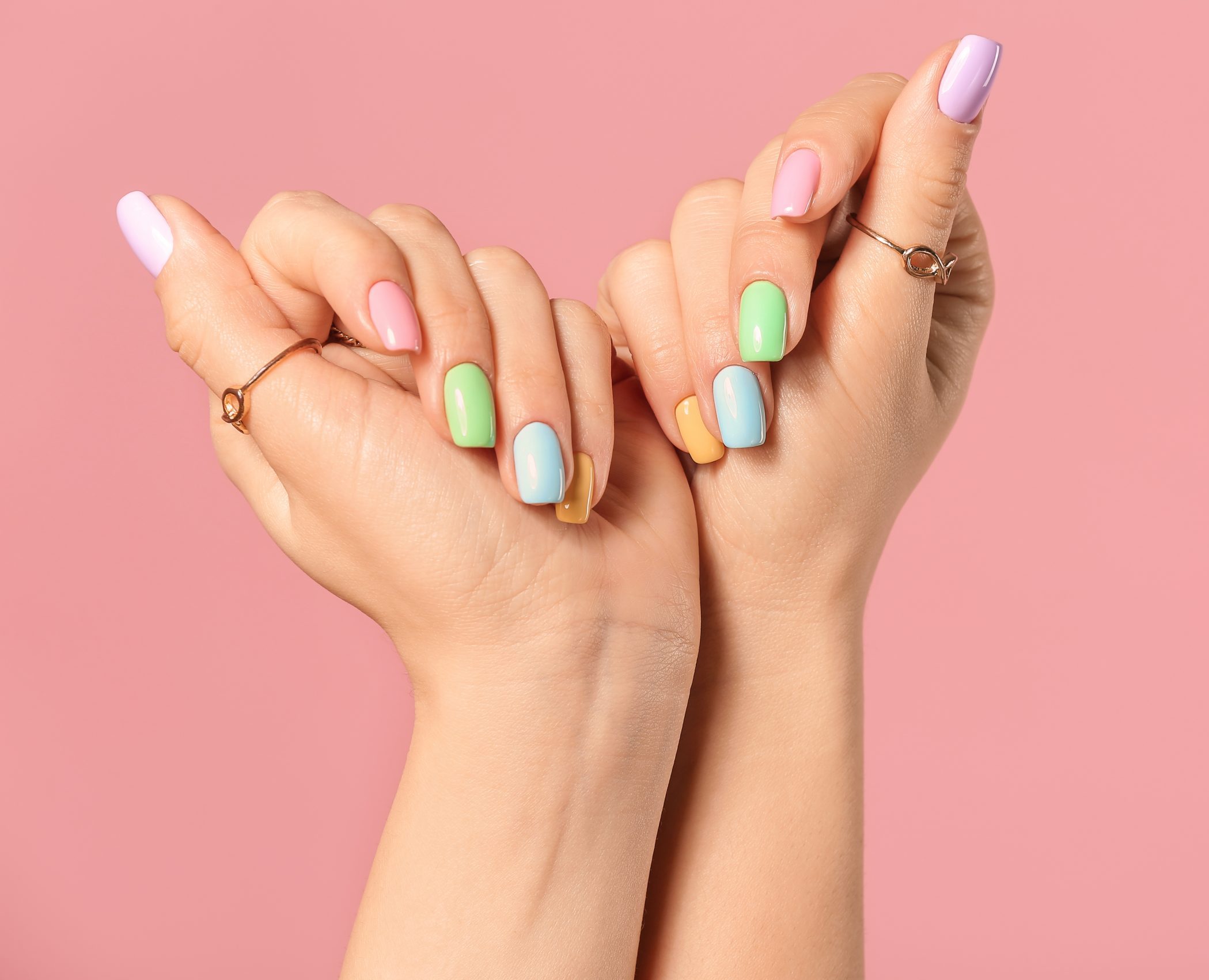 Hands,Of,Young,Woman,With,Beautiful,Manicure,On,Color,Background